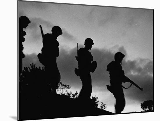 Four Soldiers with Helmets and Rifles Moving on Crest of Ridge, on Patrol at Night-Michael Rougier-Mounted Photographic Print