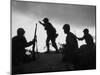 Four Soldiers with Helmets and Rifles Moving on Crest of Ridge, Patroling at Night-Michael Rougier-Mounted Photographic Print