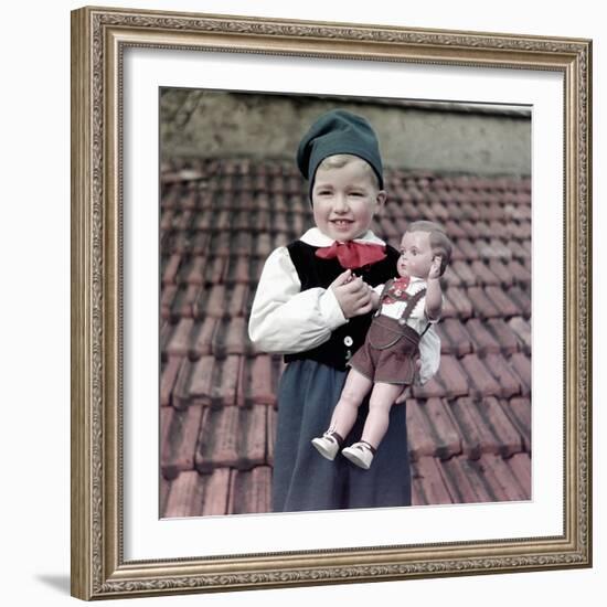 Four Year Old German Boy Stands with His Lederhosen Dressed Doll, Ca. 1949-null-Framed Photographic Print