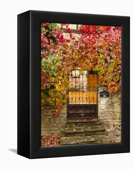 France, Midi-Pyrenees Region, Tarn Department, Cordes-Sur-Ciel, Gate with Autumn Foliage-Walter Bibikow-Framed Premier Image Canvas