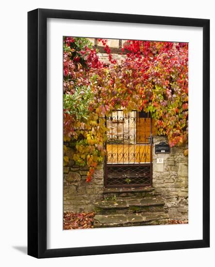 France, Midi-Pyrenees Region, Tarn Department, Cordes-Sur-Ciel, Gate with Autumn Foliage-Walter Bibikow-Framed Photographic Print