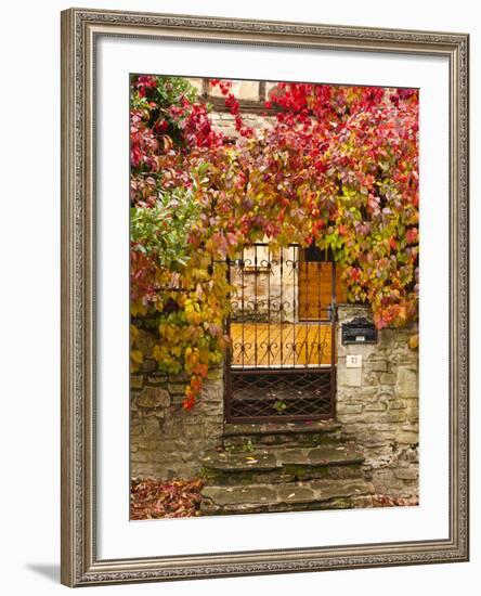 France, Midi-Pyrenees Region, Tarn Department, Cordes-Sur-Ciel, Gate with Autumn Foliage-Walter Bibikow-Framed Photographic Print