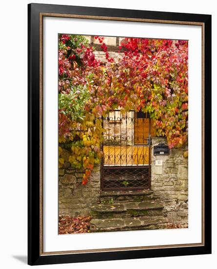 France, Midi-Pyrenees Region, Tarn Department, Cordes-Sur-Ciel, Gate with Autumn Foliage-Walter Bibikow-Framed Photographic Print