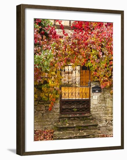 France, Midi-Pyrenees Region, Tarn Department, Cordes-Sur-Ciel, Gate with Autumn Foliage-Walter Bibikow-Framed Photographic Print