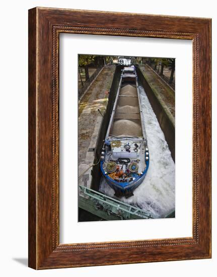 France, Paris, Canal St-Martin, barge and bargeman (NR) in canal locks by the Quai de Jemmapes-Walter Bibikow-Framed Photographic Print