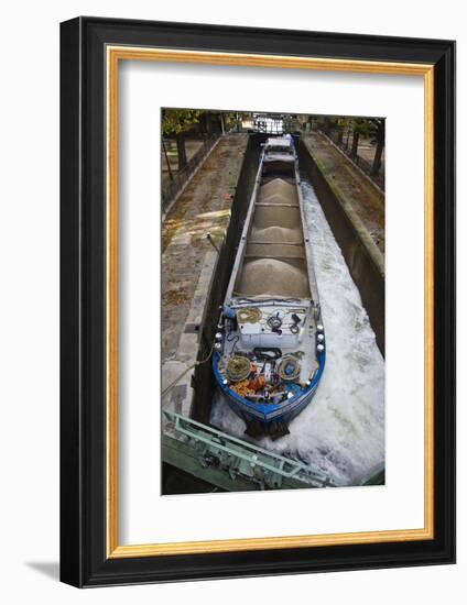 France, Paris, Canal St-Martin, barge and bargeman (NR) in canal locks by the Quai de Jemmapes-Walter Bibikow-Framed Photographic Print