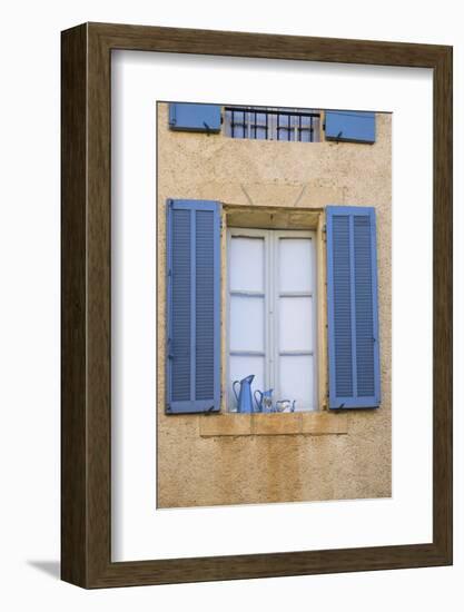 France, Provence, Lourmarin. Blue Shutters Frame a Scene of Blue Pitchers on a Windowsill-Brenda Tharp-Framed Photographic Print