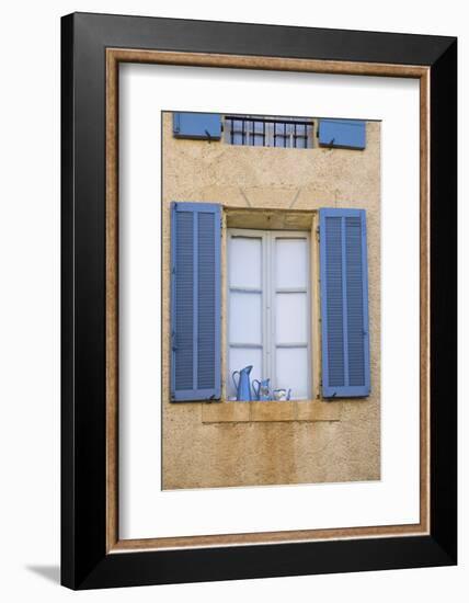 France, Provence, Lourmarin. Blue Shutters Frame a Scene of Blue Pitchers on a Windowsill-Brenda Tharp-Framed Photographic Print