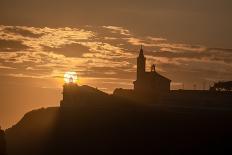 Sun aligned with the silhouette of the lighthouse and church of Luarca, Asturias, Spain, Europe-Francesco Fanti-Photographic Print