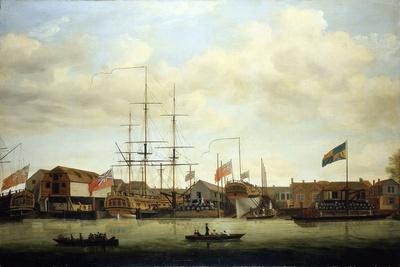 a-small-shipyard-on-the-thames-england-with-two-boats-under