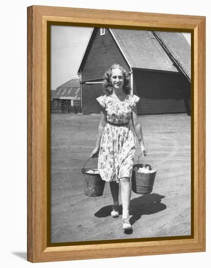 Francis Larson Collecting Eggs on Her Farm-Bob Landry-Framed Premier Image Canvas