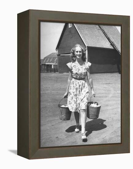 Francis Larson Collecting Eggs on Her Farm-Bob Landry-Framed Premier Image Canvas