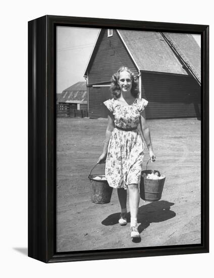 Francis Larson Collecting Eggs on Her Farm-Bob Landry-Framed Premier Image Canvas