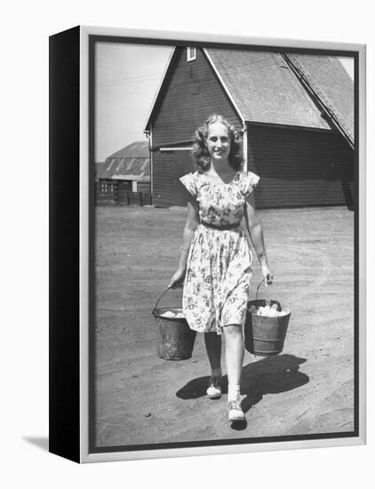 Francis Larson Collecting Eggs on Her Farm-Bob Landry-Framed Premier Image Canvas