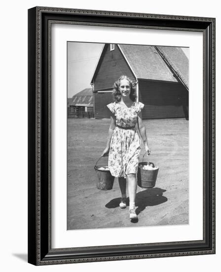 Francis Larson Collecting Eggs on Her Farm-Bob Landry-Framed Photographic Print