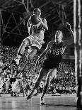 Burke Scott of Hoosiers Basketball Team Leaping Through Air Towards Lay Up Shot at Basketball Hoop-Francis Miller-Photographic Print