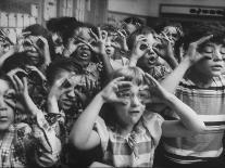 Classroom Full of Students Circling Fingers Around Eyes in Form of Glasses During Music Class-Francis Miller-Photographic Print