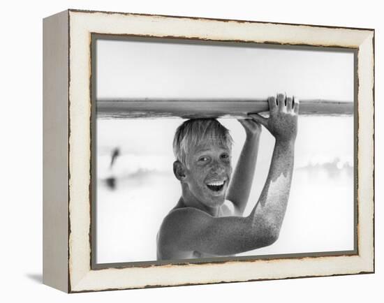 Freckled Surfer Larry Shaw Carrying Surfboard on His Head-Allan Grant-Framed Premier Image Canvas