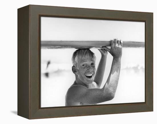 Freckled Surfer Larry Shaw Carrying Surfboard on His Head-Allan Grant-Framed Premier Image Canvas