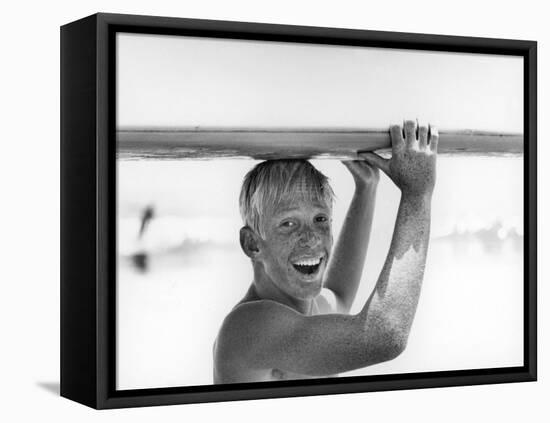 Freckled Surfer Larry Shaw Carrying Surfboard on His Head-Allan Grant-Framed Premier Image Canvas