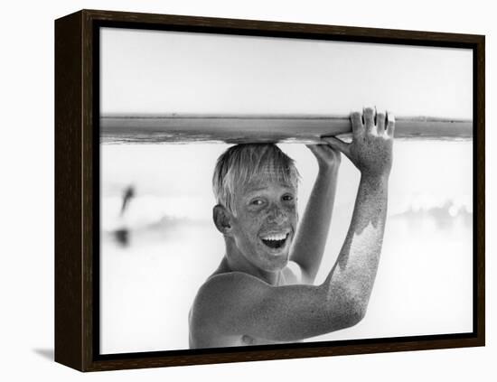 Freckled Surfer Larry Shaw Carrying Surfboard on His Head-Allan Grant-Framed Premier Image Canvas