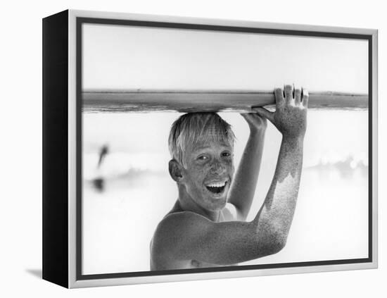 Freckled Surfer Larry Shaw Carrying Surfboard on His Head-Allan Grant-Framed Premier Image Canvas