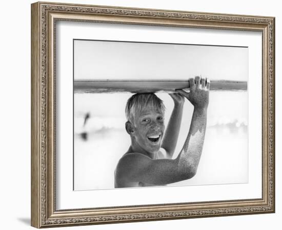 Freckled Surfer Larry Shaw Carrying Surfboard on His Head-Allan Grant-Framed Photographic Print