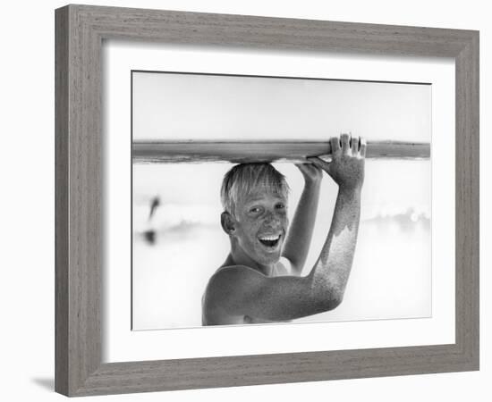 Freckled Surfer Larry Shaw Carrying Surfboard on His Head-Allan Grant-Framed Photographic Print