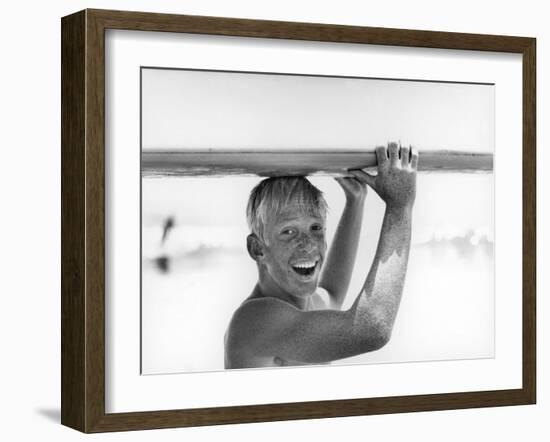 Freckled Surfer Larry Shaw Carrying Surfboard on His Head-Allan Grant-Framed Photographic Print