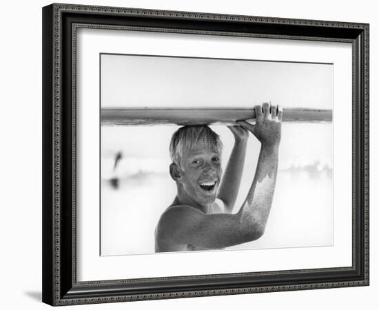 Freckled Surfer Larry Shaw Carrying Surfboard on His Head-Allan Grant-Framed Photographic Print