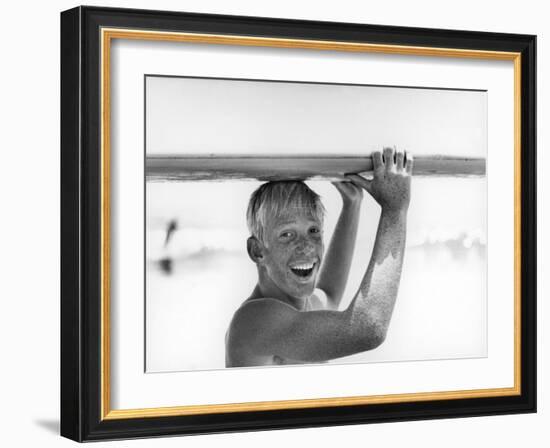 Freckled Surfer Larry Shaw Carrying Surfboard on His Head-Allan Grant-Framed Photographic Print