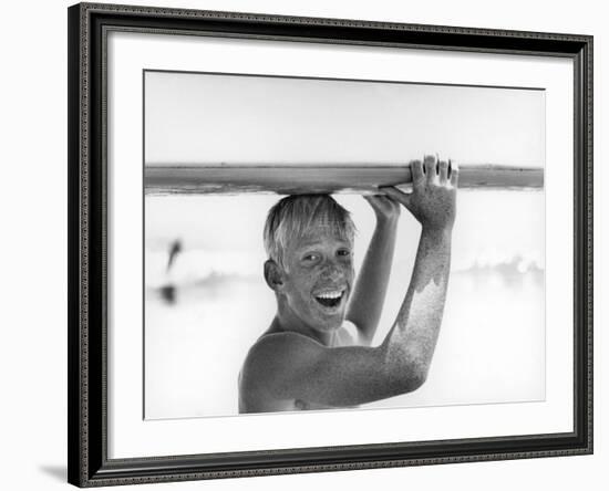 Freckled Surfer Larry Shaw Carrying Surfboard on His Head-Allan Grant-Framed Photographic Print