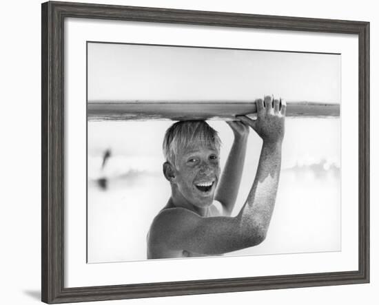 Freckled Surfer Larry Shaw Carrying Surfboard on His Head-Allan Grant-Framed Photographic Print