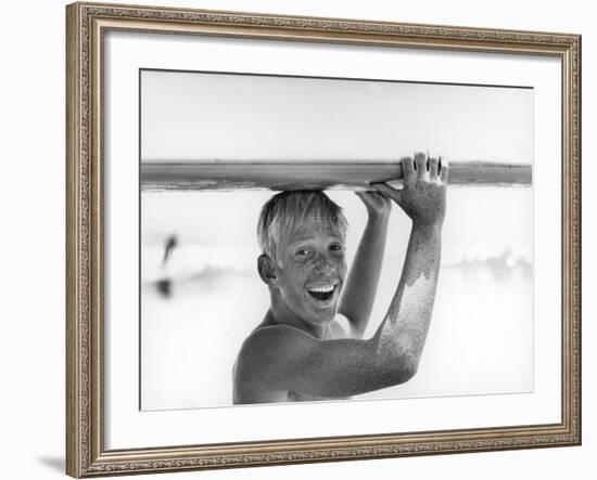 Freckled Surfer Larry Shaw Carrying Surfboard on His Head-Allan Grant-Framed Photographic Print