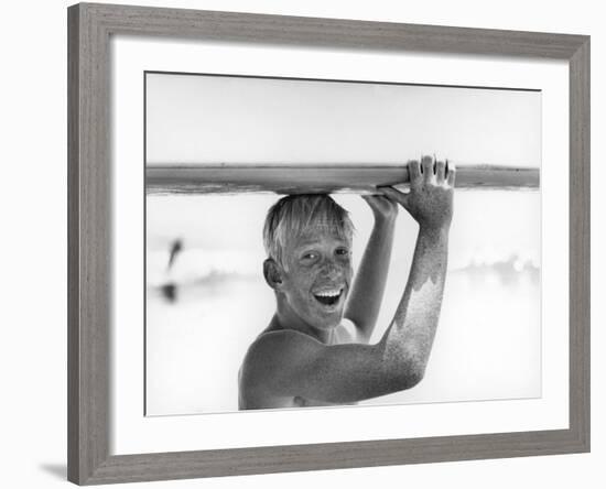 Freckled Surfer Larry Shaw Carrying Surfboard on His Head-Allan Grant-Framed Photographic Print