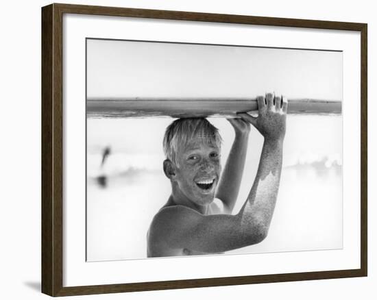 Freckled Surfer Larry Shaw Carrying Surfboard on His Head-Allan Grant-Framed Photographic Print