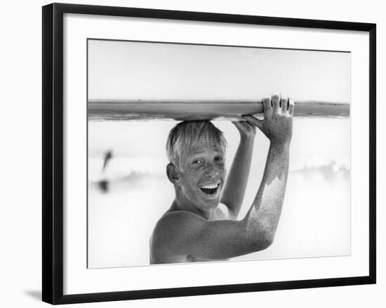 Freckled Surfer Larry Shaw Carrying Surfboard on His Head-Allan Grant-Framed Photographic Print