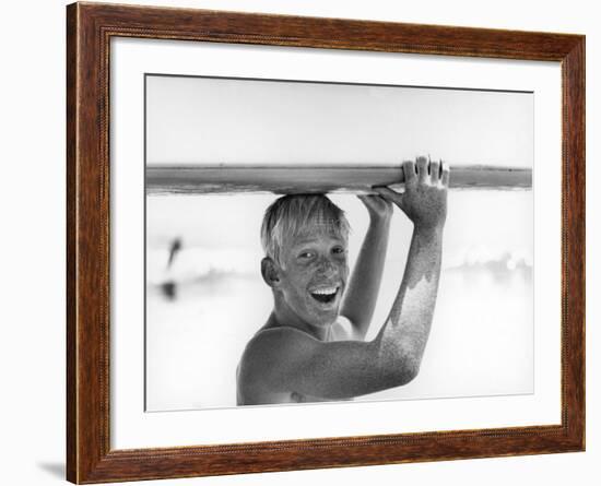 Freckled Surfer Larry Shaw Carrying Surfboard on His Head-Allan Grant-Framed Photographic Print