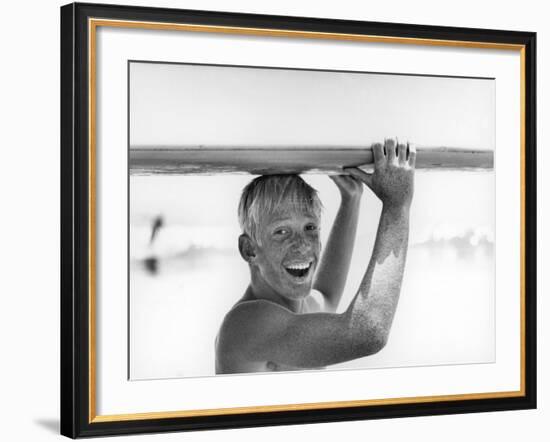 Freckled Surfer Larry Shaw Carrying Surfboard on His Head-Allan Grant-Framed Photographic Print