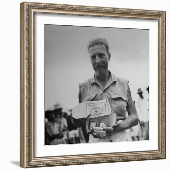 Freed American Pow Holding Red Cross Supplies after His Release from a Japanese Prison Camp-Carl Mydans-Framed Photographic Print