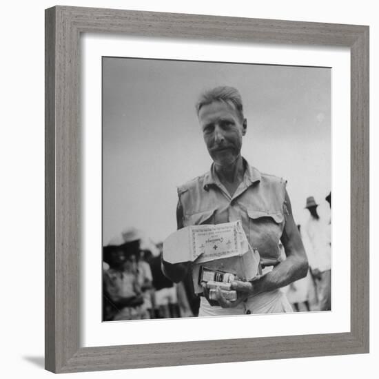 Freed American Pow Holding Red Cross Supplies after His Release from a Japanese Prison Camp-Carl Mydans-Framed Photographic Print