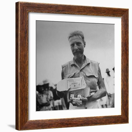 Freed American Pow Holding Red Cross Supplies after His Release from a Japanese Prison Camp-Carl Mydans-Framed Photographic Print