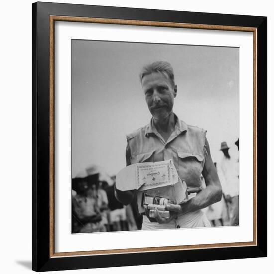 Freed American Pow Holding Red Cross Supplies after His Release from a Japanese Prison Camp-Carl Mydans-Framed Photographic Print