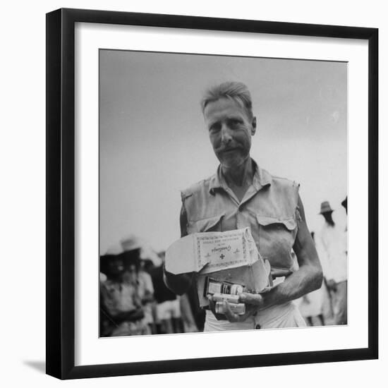 Freed American Pow Holding Red Cross Supplies after His Release from a Japanese Prison Camp-Carl Mydans-Framed Photographic Print