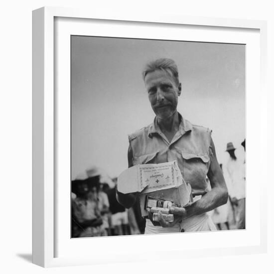 Freed American Pow Holding Red Cross Supplies after His Release from a Japanese Prison Camp-Carl Mydans-Framed Photographic Print