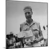 Freed American Pow Holding Red Cross Supplies after His Release from a Japanese Prison Camp-Carl Mydans-Mounted Photographic Print