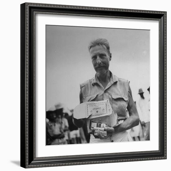 Freed American Pow Holding Red Cross Supplies after His Release from a Japanese Prison Camp-Carl Mydans-Framed Photographic Print