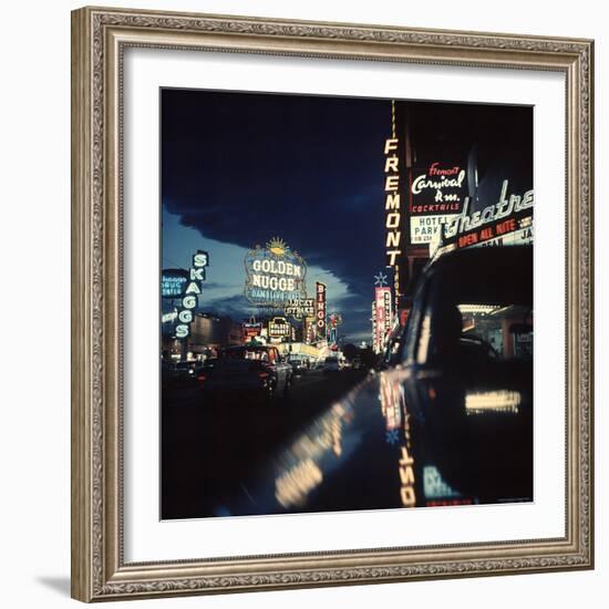 Fremont Street at Night Lit Up by Gambling Casino Neon Signs-Nat Farbman-Framed Photographic Print