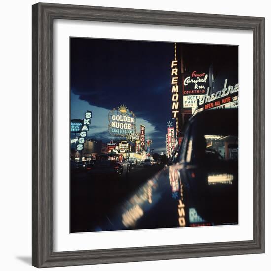 Fremont Street at Night Lit Up by Gambling Casino Neon Signs-Nat Farbman-Framed Photographic Print