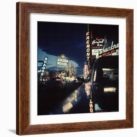 Fremont Street at Night Lit Up by Gambling Casino Neon Signs-Nat Farbman-Framed Photographic Print